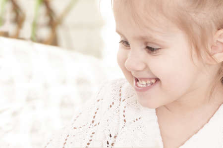 closeup portrait of a little smiling three year old girlの写真素材