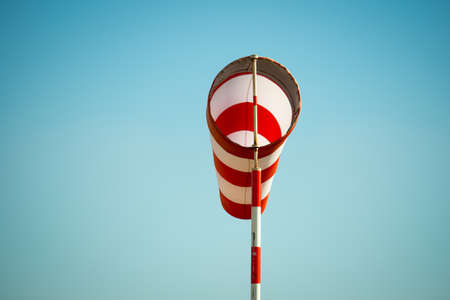Horizontally flying windsock (wind vane) due to high wind.