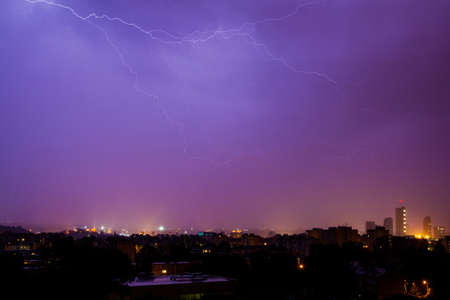 Lightning hits the city on a rainy nightの写真素材
