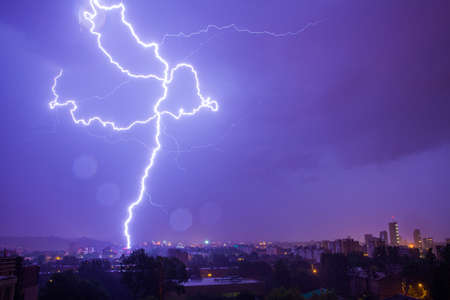 Lightning hits the city on a rainy nightの写真素材