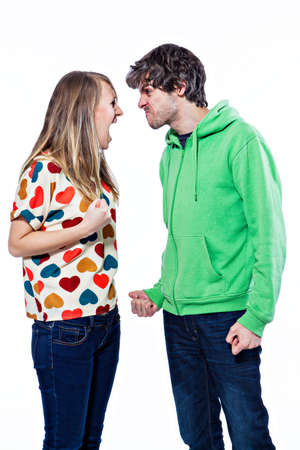 Young couple fighting and yelling on each otherの写真素材
