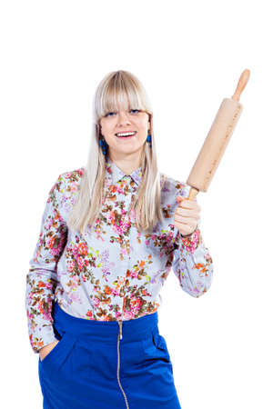 Beautiful girl holding rolling-pin isolated on a white backgroundの写真素材