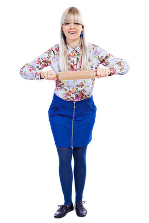Beautiful girl holding rolling-pin isolated on a white backgroundの写真素材