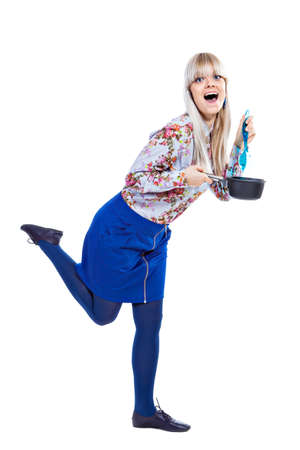 Beautiful girl holding pot and mixing it isolated on white backgroundの写真素材