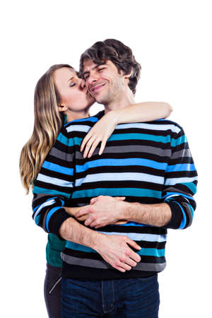 Happy young couple hugging each other isolated on a white backgroundの写真素材