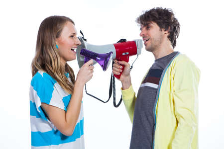 Couple using two megaphones to speakの写真素材