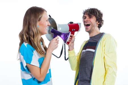 Couple using two megaphones to speakの写真素材