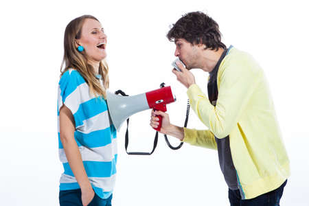 Couple using megaphone to speakの写真素材