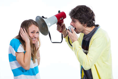Man using megaphone to talk to a wifeの写真素材
