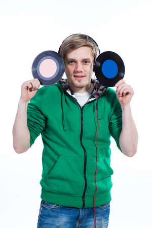 Young man holding vinylsの写真素材