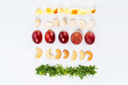 Lines of different food on the white tableの写真素材