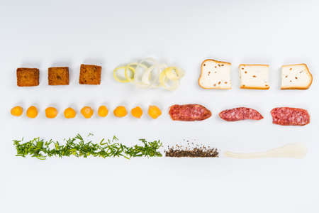 Lines of different food on the white tableの写真素材