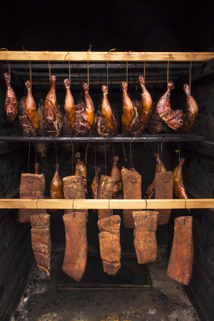 Stages of smoking. Ready-smoked meat in the smokehouseの写真素材