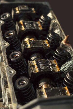 Interior of an old worn internal combustion engine. Nagar, black deposits inside the engine,...