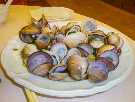 Cooked small vongole at a plateの写真素材