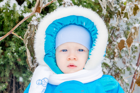 Baby boy surprised with snowの写真素材
