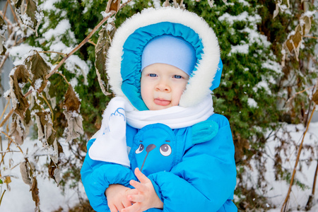 Baby boy surprised with snowの写真素材