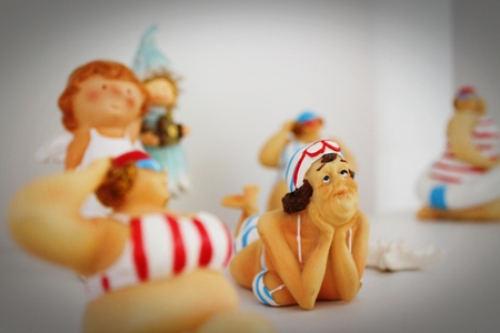 Ceramic doll with smile girl for decorationの写真素材