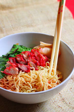 close-up of a bowl of noodles with chopsticksの写真素材
