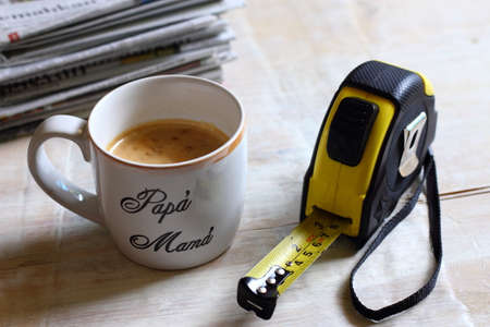 A working desk of an Engineer with coffee and newspaperの写真素材