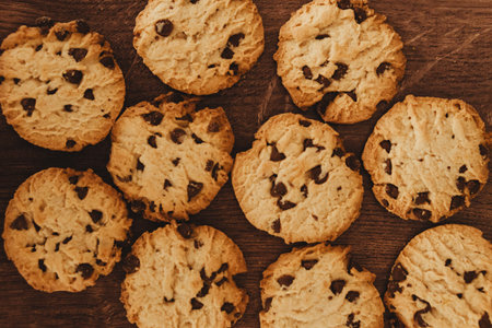 Savoring Simplicity: Homemade cookies and a glass of milk on an elegant wooden table.の写真素材