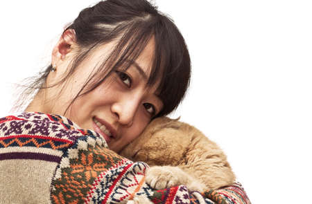 Isolation photo of a pretty Chinese girl hugging her pet, a CPA garfield catの写真素材