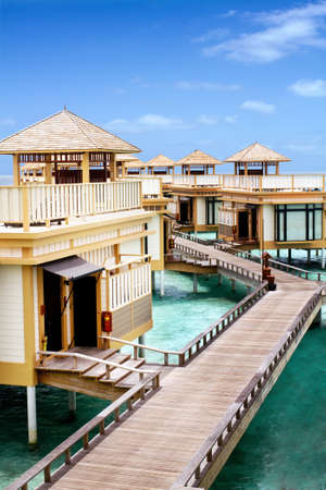 Landscape photo of Island in ocean, overwater villa with endless swimming pools. Maldives. のeditorial素材