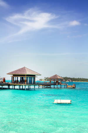 Landscape photo of Island in ocean, overwater villa with endless swimming pools. Maldives. のeditorial素材