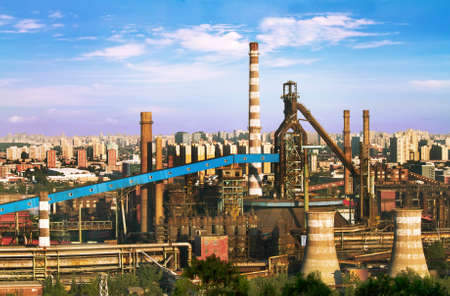 Landscape of construction power factories with big chimneys and modern buildings in backgroundのeditorial素材
