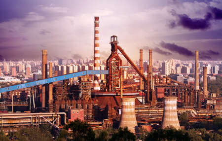 Landscape of construction power factories with big chimneys and modern buildings in backgroundのeditorial素材
