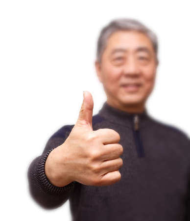 Closeup isolation photo of senior Chinese man showing ok and good with fingersの写真素材