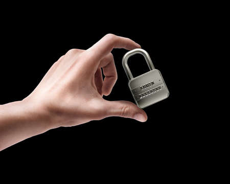 Man's hand holding lock password isolated on black background 