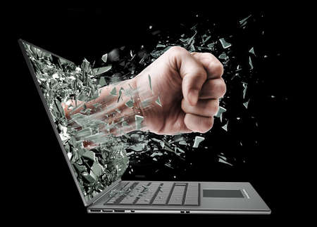 Fist from laptop. Isolated on black background High resolution