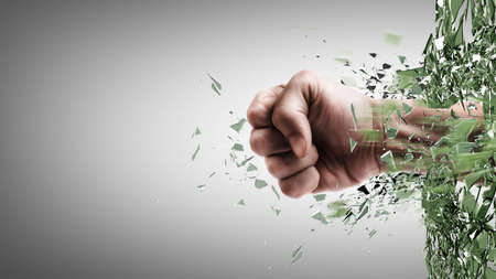 power fist coming out of cracked glass の写真素材