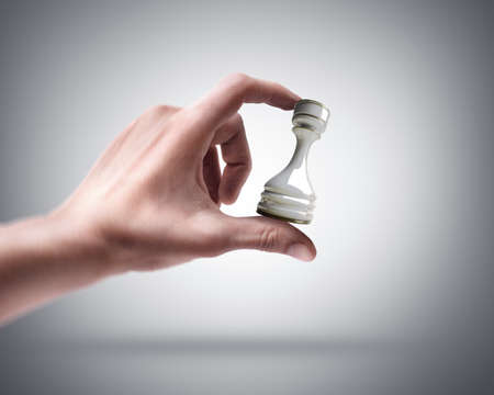 Man's hand holding Chess Castleの写真素材