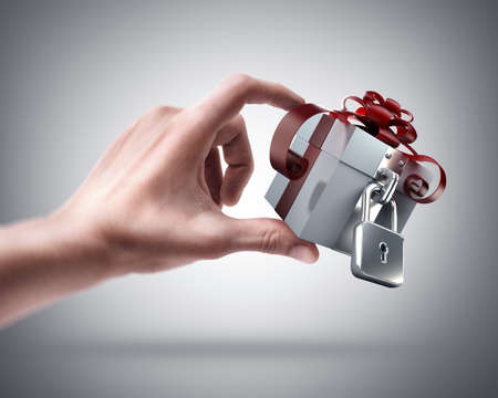 Man's hand holding Gift box with the lock