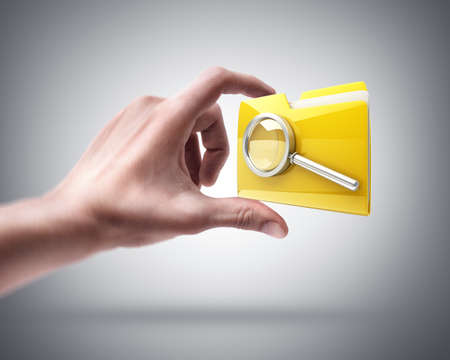 Man's hand holding Yellow folder with a symbol
