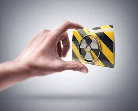 Man's hand holding Yellow folder with a symbolの写真素材