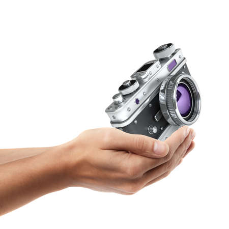 Man hand holding object ( Vintage silver photo camera )  isolated on white background. High resolution の写真素材