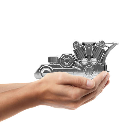 Man hand holding object ( chromed motorcycle engine  )  isolated on white background. High...
