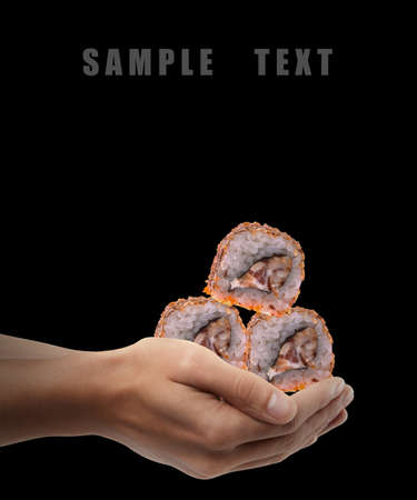 Man hand holding sushi isolated on back background. High resolution の写真素材