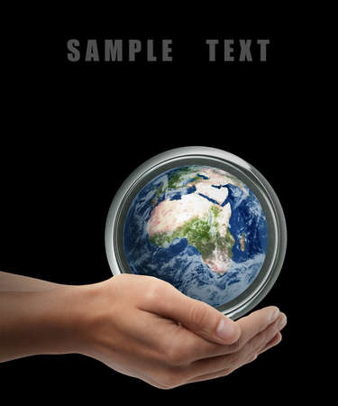 Man hand holding object ( Earth ) isolated on black background. High resolution. の写真素材