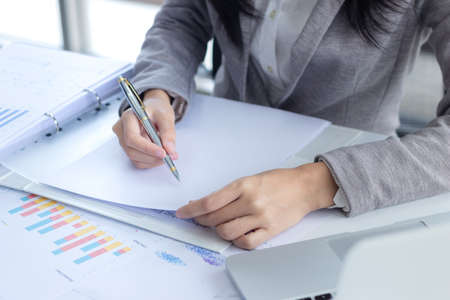 business female working with document at office building