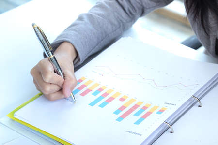 business female working with document at office building
