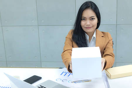 business woman get a package at workplace