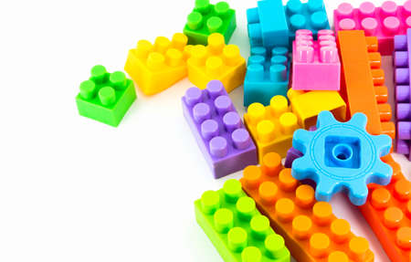 Toy colorful plastic blocks on white backgroundの写真素材