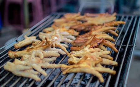 Chicken feet on a grillの写真素材