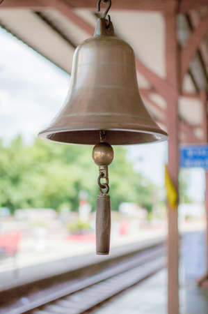 Brass bell in train station