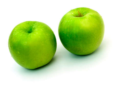 Green apples on a white の写真素材