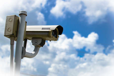 CCTV security camera under blue sky